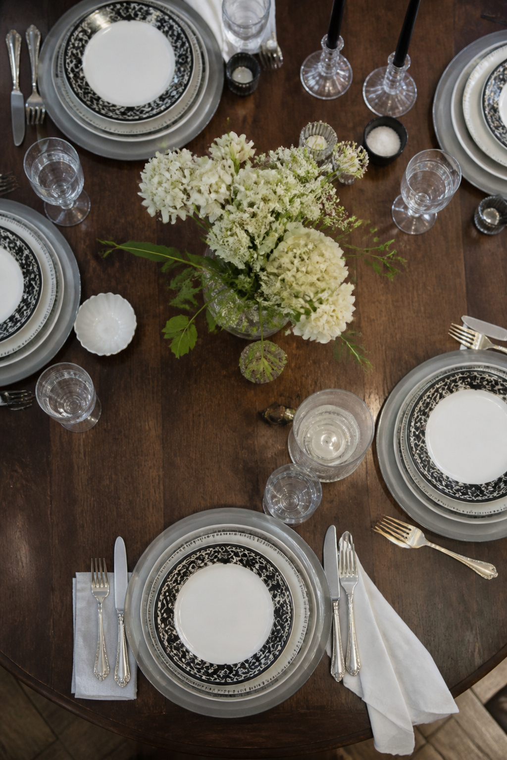 6 Black and White Table Setting Ideas for 2026 3 Black Lace Noritake china layered on mismatched vintage plates.