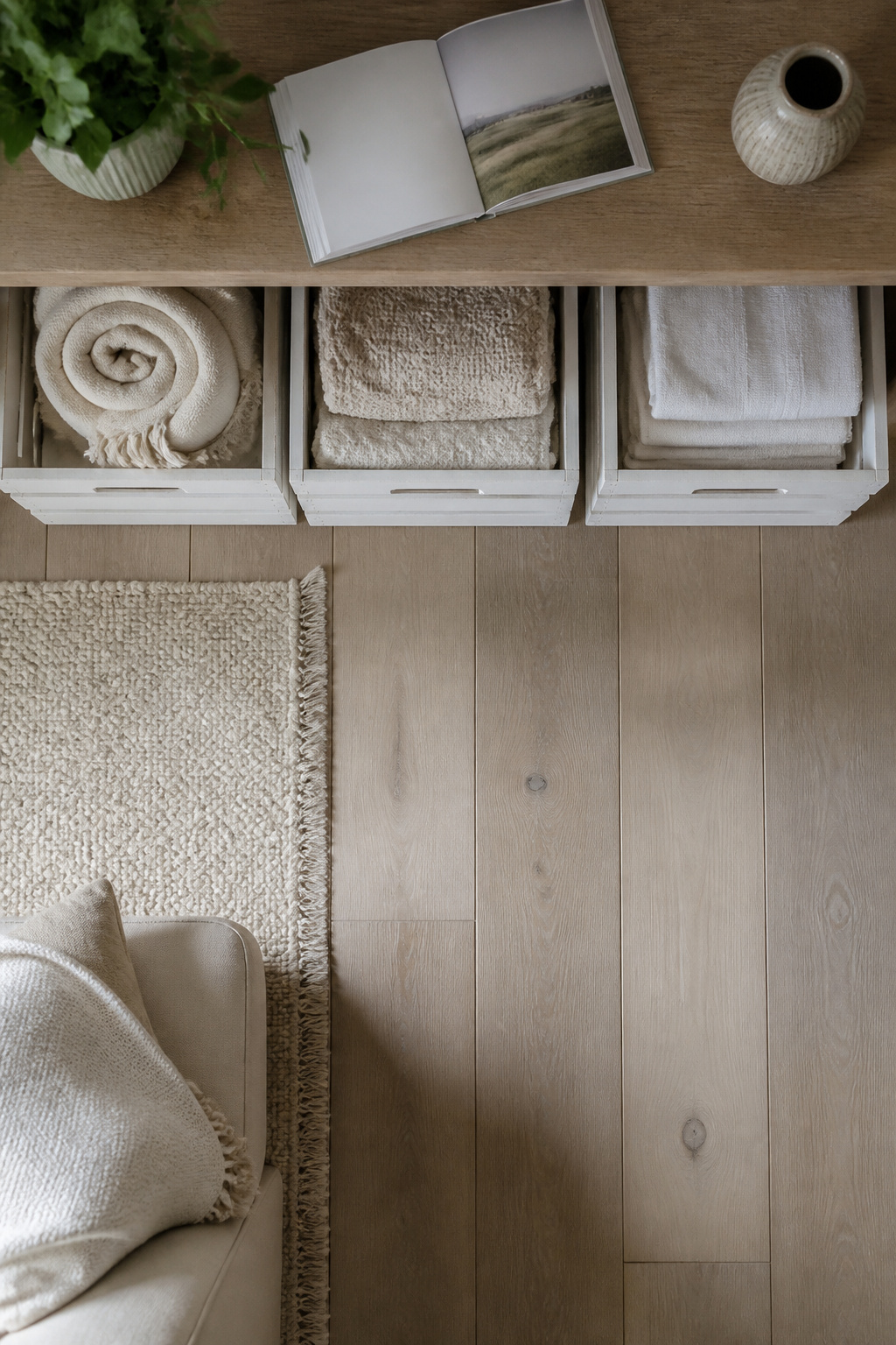 11 Ways to Decorate with Wooden Crates for Any Room 5 Wooden crates used for storing rolled blankets and towels.