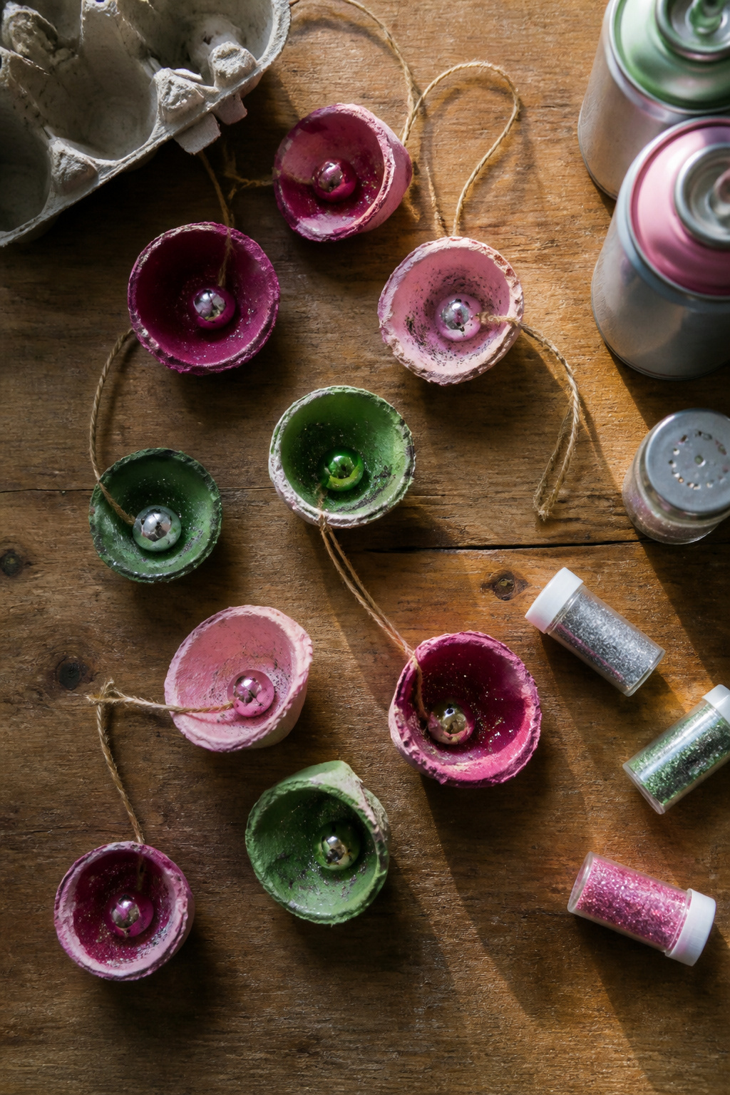 40 DIY Christmas Ornaments to Make in 2026 12 Jingle bell ornaments made from egg carton cups.