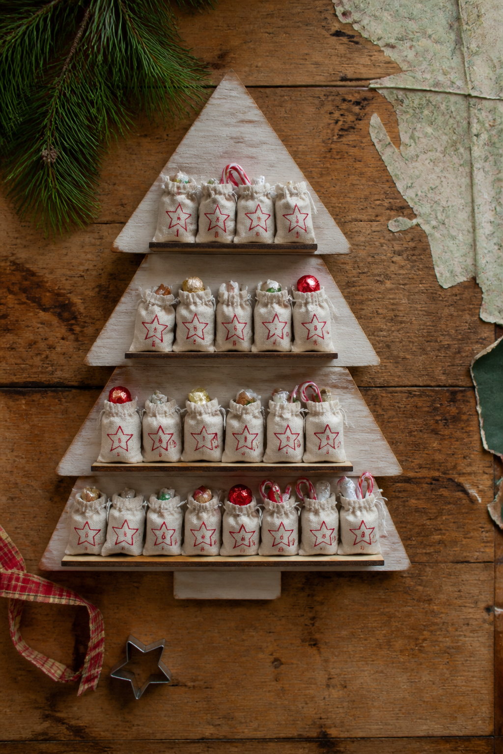 DIY Scrap Wood Christmas Projects for Decor and Gifts 5 Scrap wood advent calendar featuring shelves and hooks for gifts.