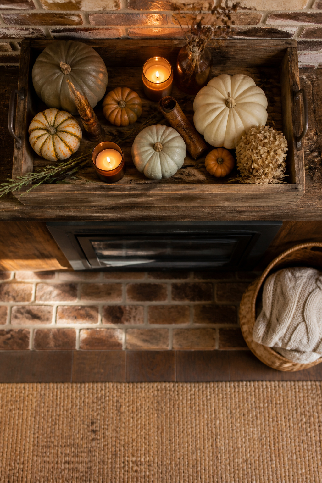 7 Farmhouse Fall Mantel Ideas: Cozy Decor for 2026 4 Reclaimed barn wood tray displaying mini pumpkins on a mantel.