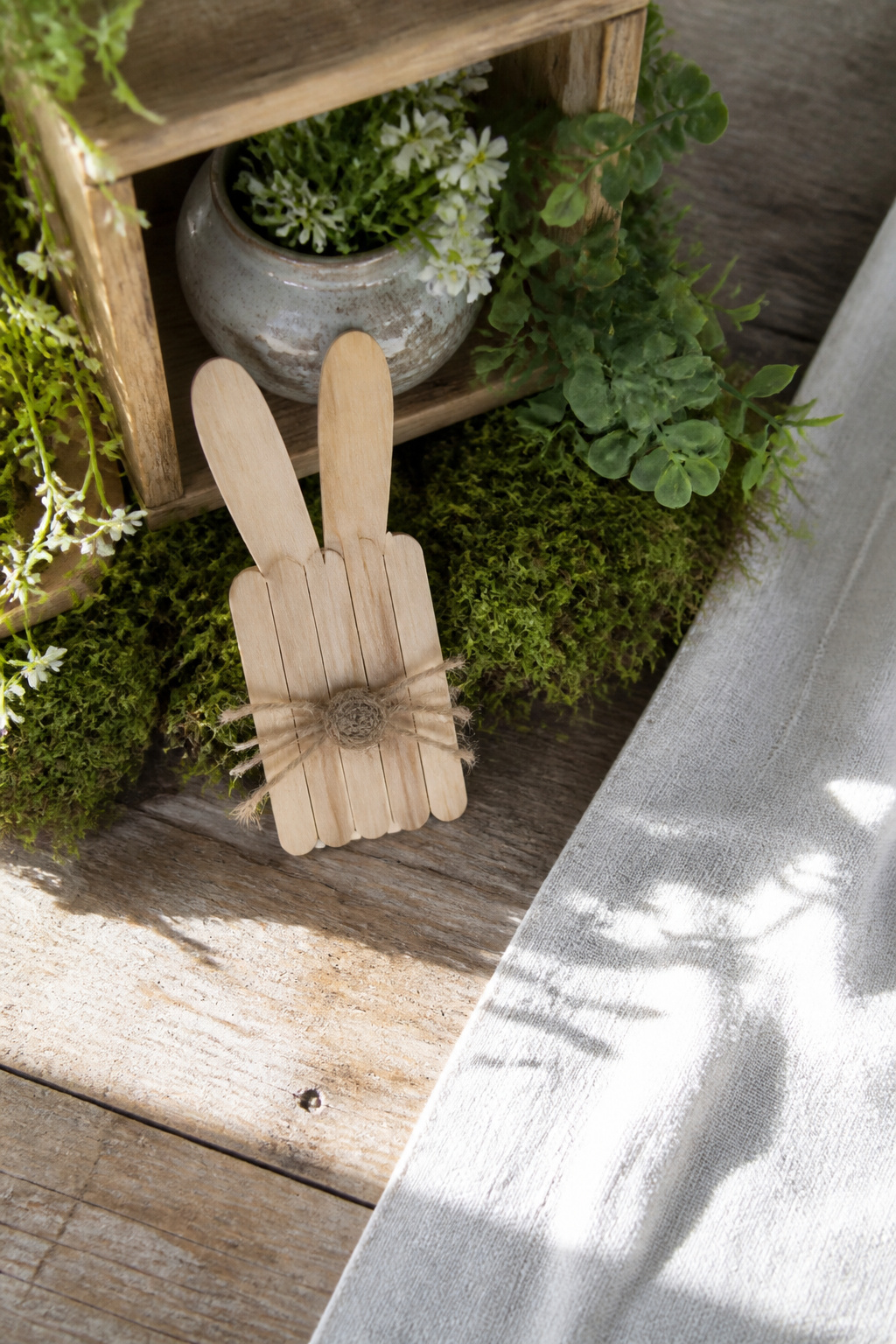 10 Rustic Easter Decor DIY Ideas for 2026 5 Flat craft stick pieces arranged to create bunny shapes.