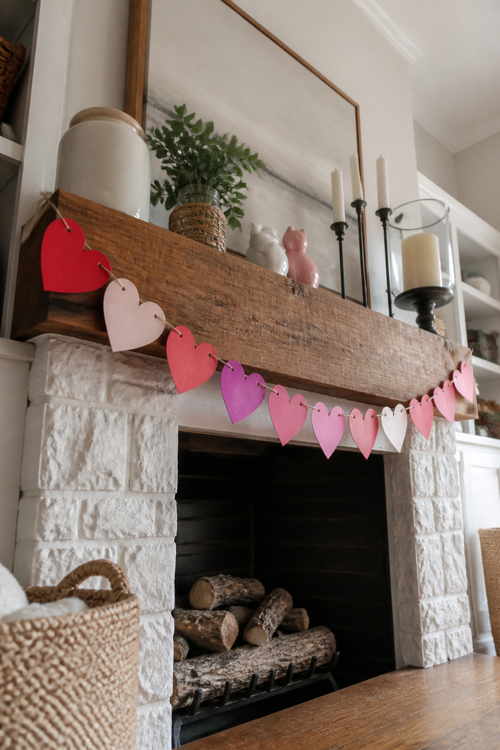 10 Simple Valentine Decorations Ideas for 2026 10 Handmade banner strung across a mantel with paper hearts.