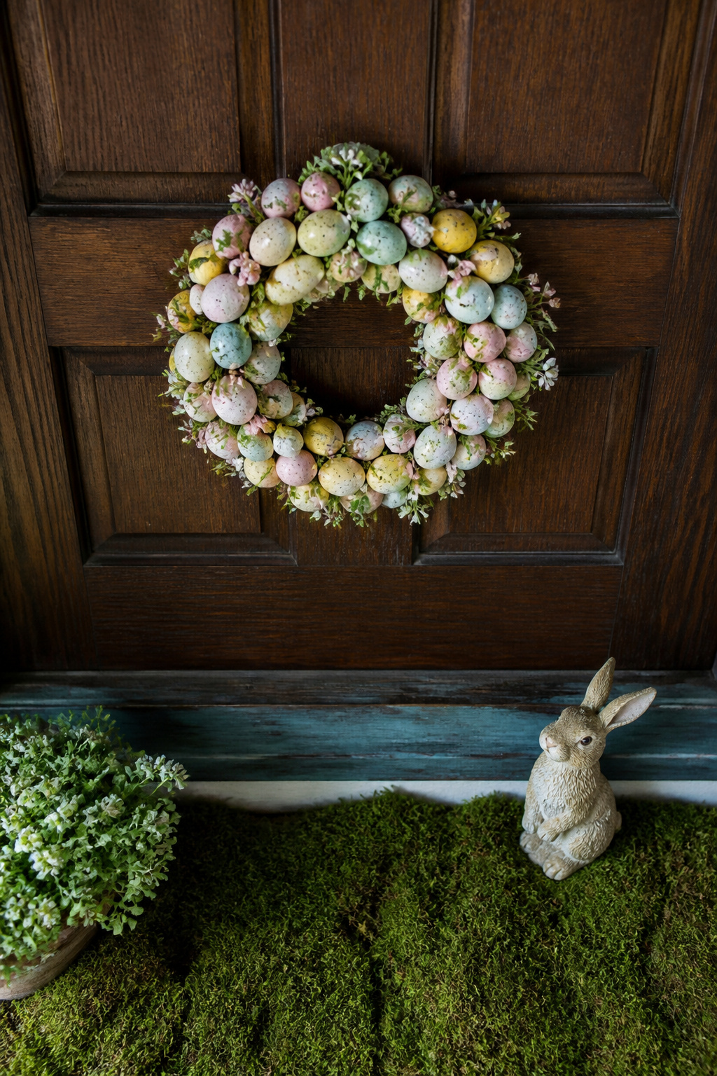 Spring Wreath Ideas for Your Front Door in 2026 6 A 16-inch egg wreath displayed on a door.