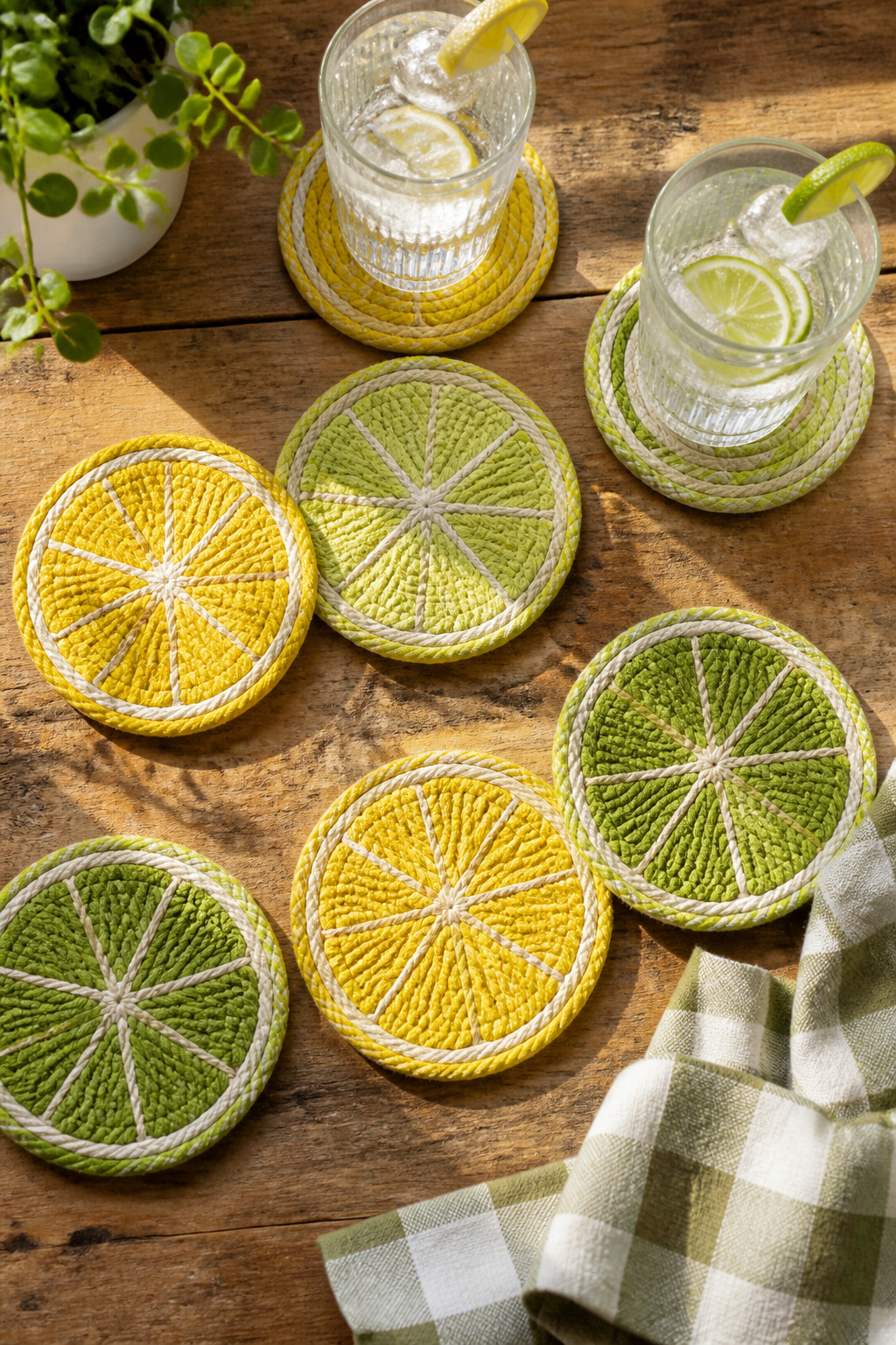 40 Summer Craft Ideas for Adults and Kids to Make in 2026 26 Coasters made from coiled cotton rope painted with citrus designs.