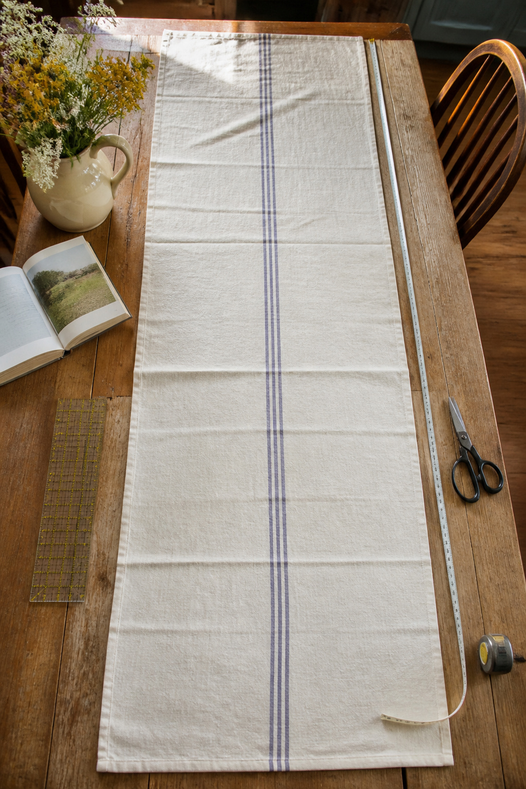 Vintage Grain Sack Table Runner: Methods, Materials and Sources 6 A grain sack laid out on a table, measuring 104 inches long.