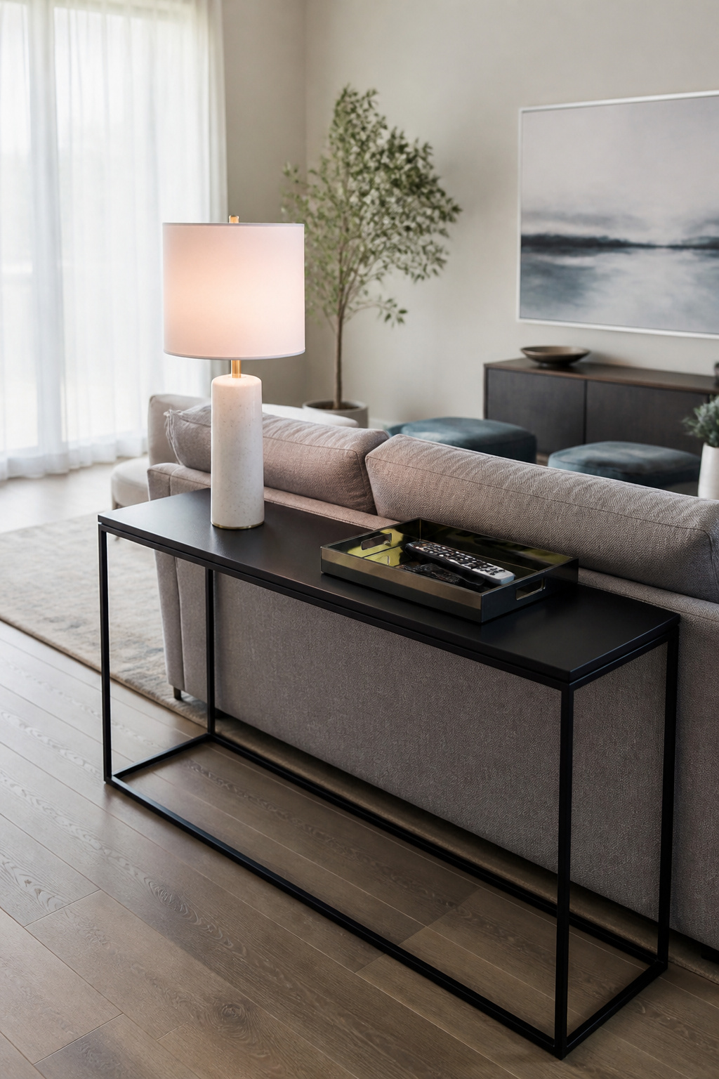 Minimalist console table with a lamp and a tray.