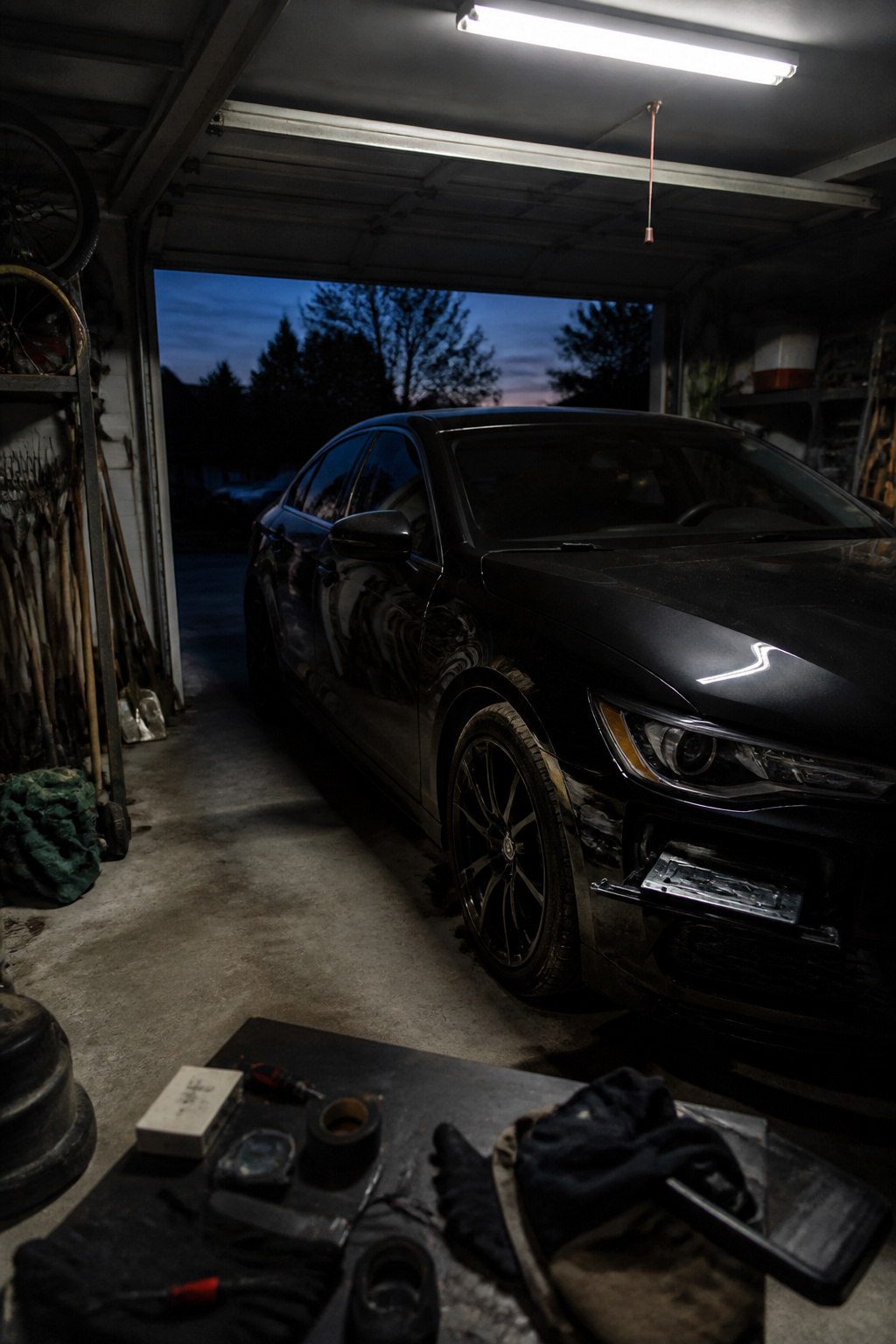 Avoid Detection: Evasion Methods in Cybersecurity and Malware, 2026 7 A dimly lit garage with a vehicle and tools related to evasion methods.
