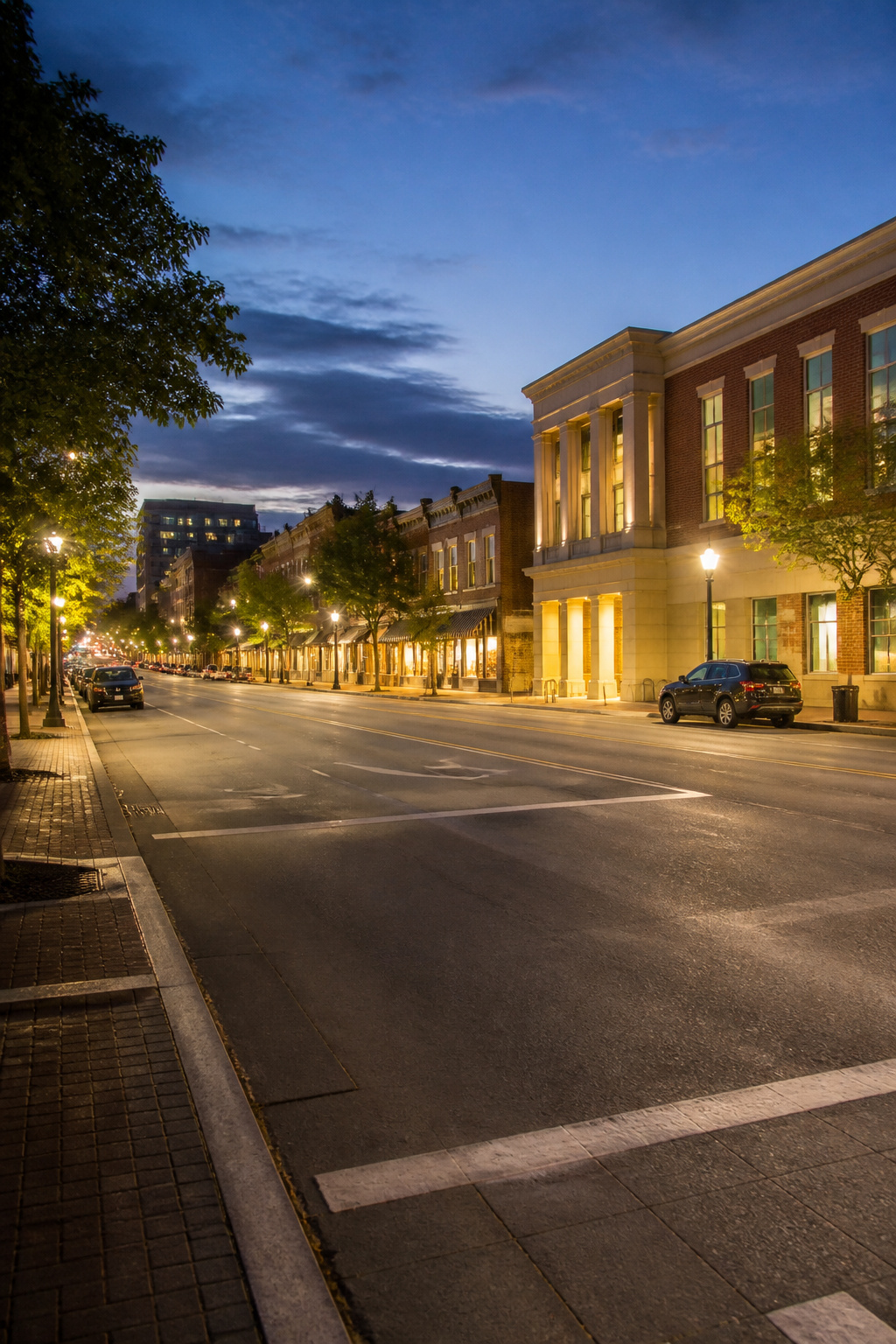 How to Be Street Smart: 8 Steps for Staying Safe in 2026 3 A busy street scene with well-lit sidewalks and people walking.