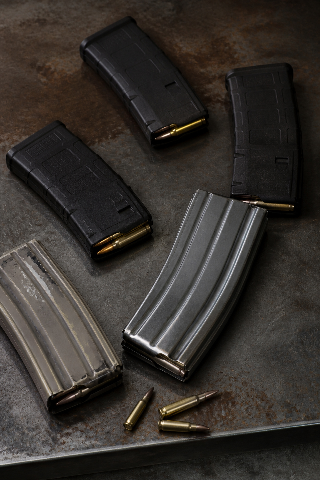 How Many Magazines Per Gun: 8 Firearm Types Covered for 2026 10 Various magazines displayed to highlight their condition and wear.
