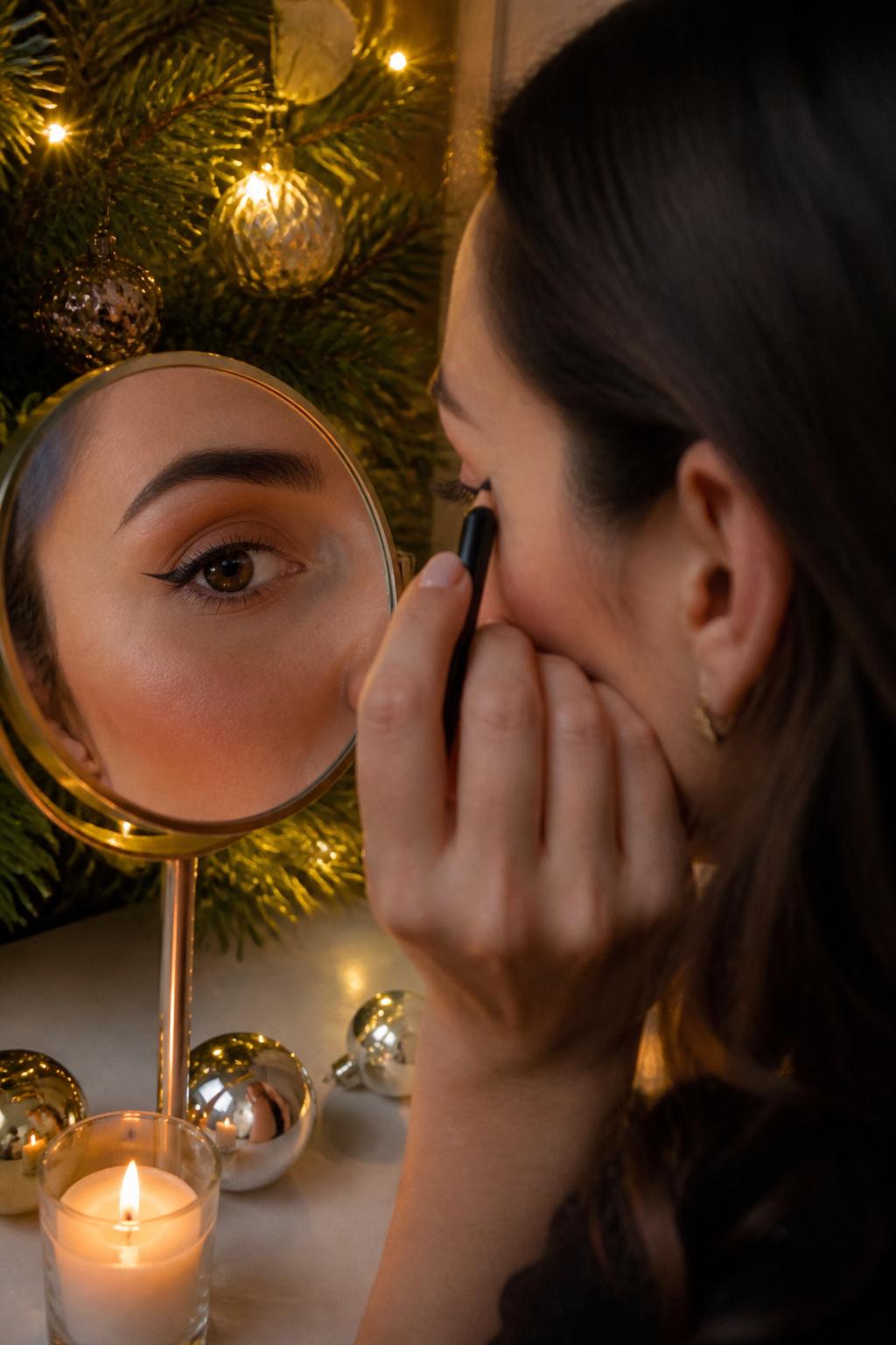 Close-up of a woman's eyes showcasing a kitten eye makeup style.