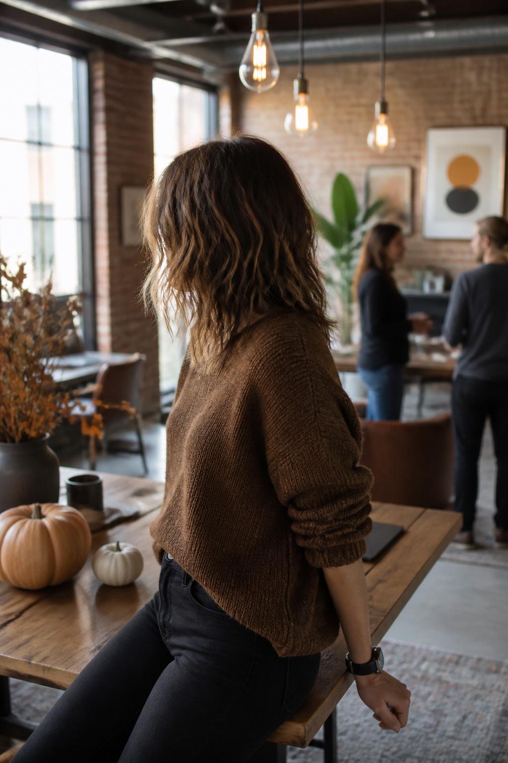 15 Cute Fall Hairstyles and Styles for 2026 12 Woman showcasing a shaglet haircut in a modern workspace.