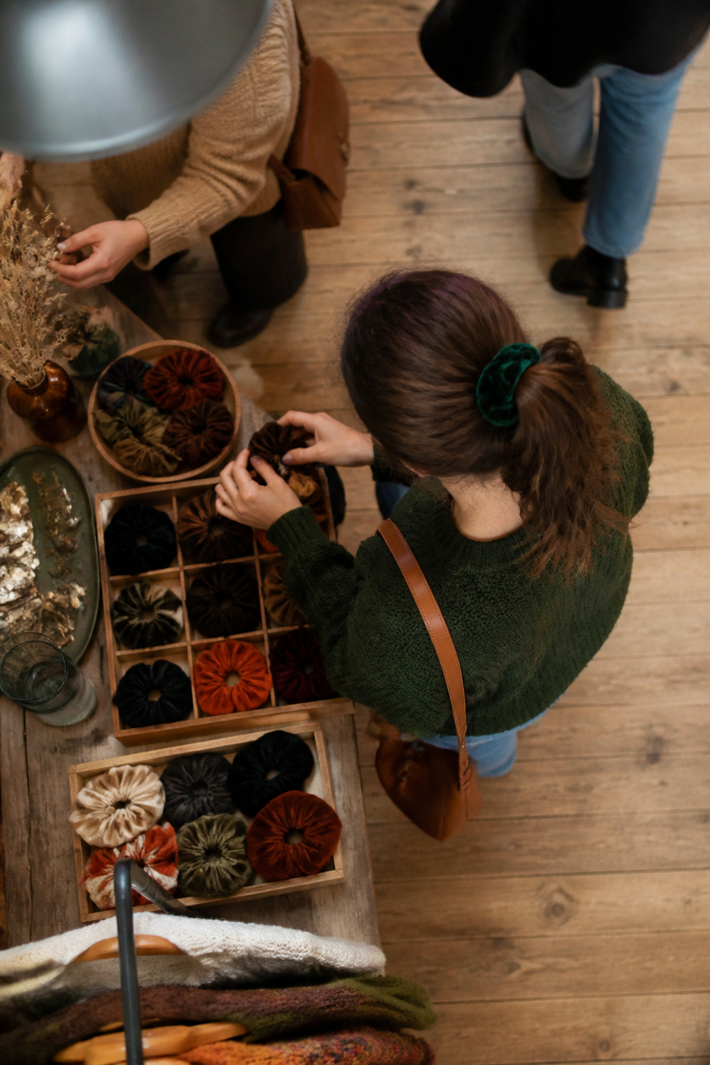 15 Cute Fall Hairstyles and Styles for 2026 16 Close-up of velvet and corduroy scrunchies on display.