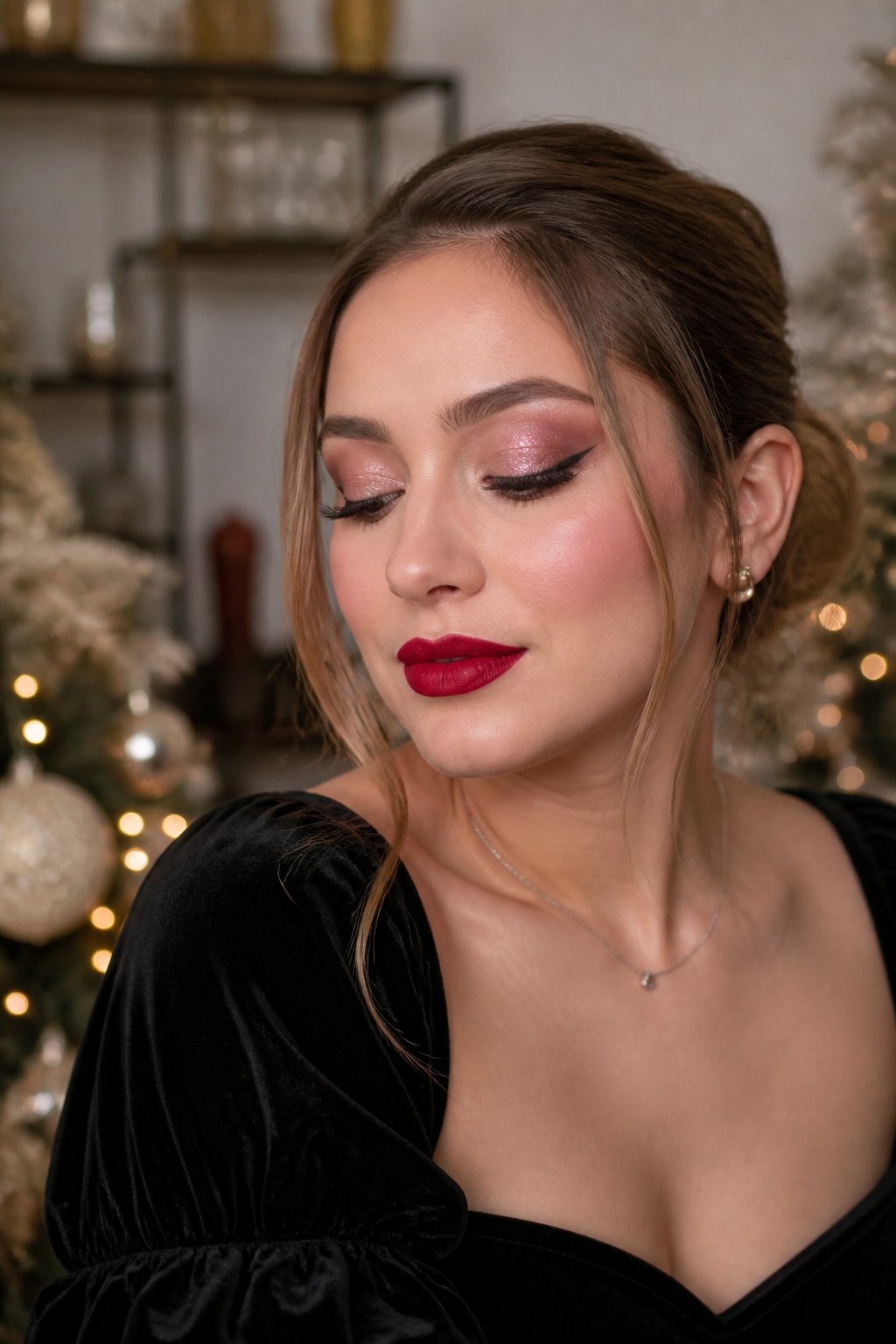 Model with a red lip and glittery eye makeup on a softly lit background.
