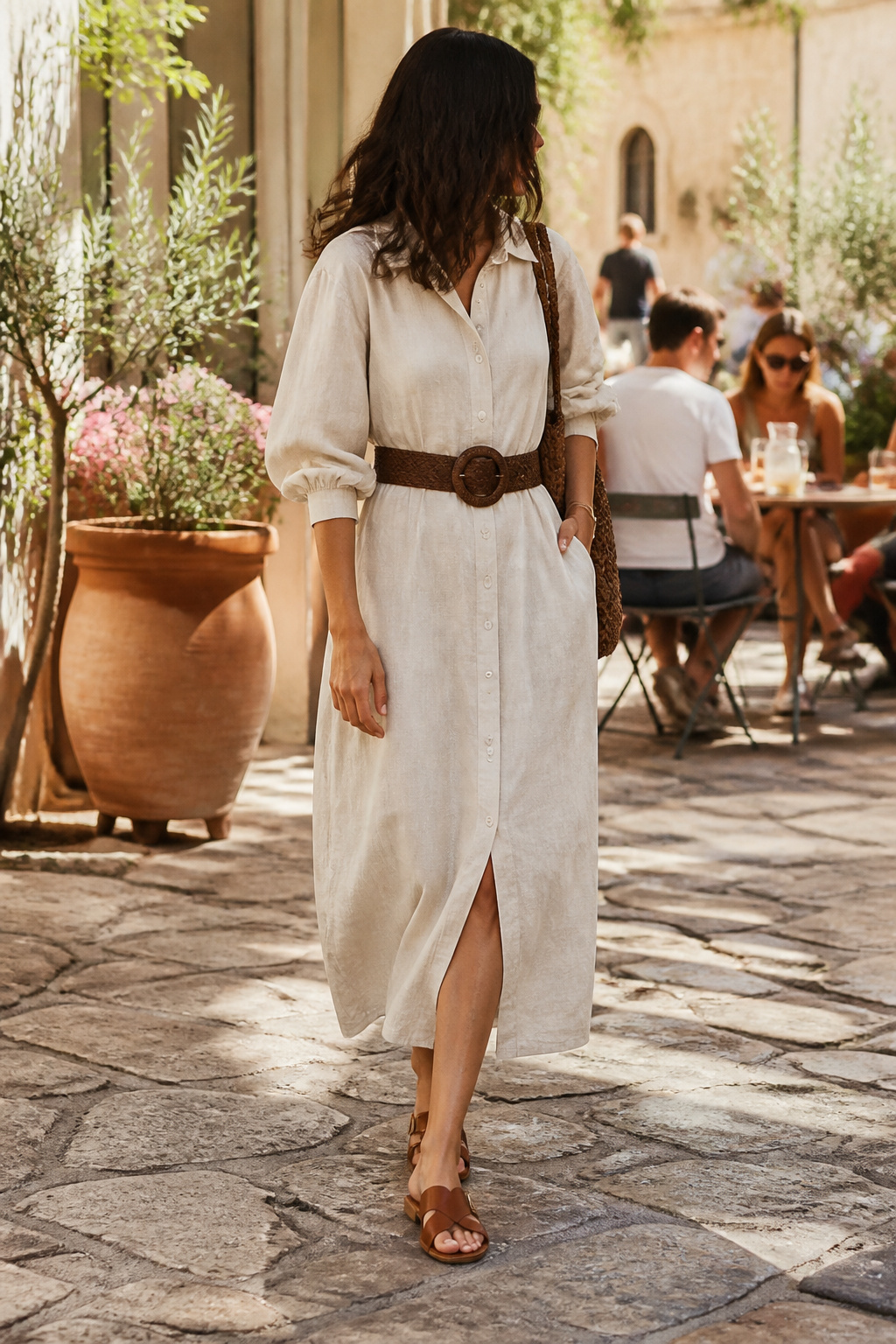 Spring Dresses for Women: Styles for 2026 5 A model styled in a shirt dress with a statement belt.
